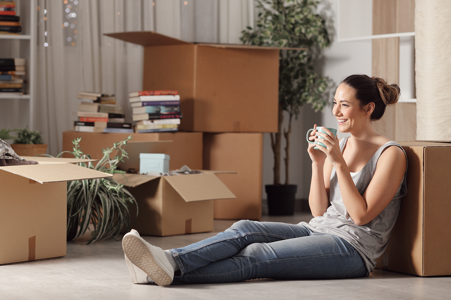 Happy tenant resting drinking coffee moving home sitting on the floor in the night; Shutterstock ID 1414028594; Purchase Order: 12813; Job: Consumer Advertising Templates; Client/Licensee: ERA Real Estate